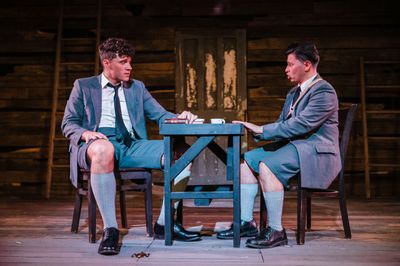 Warm amber-lit stage moment from Spring Awakening