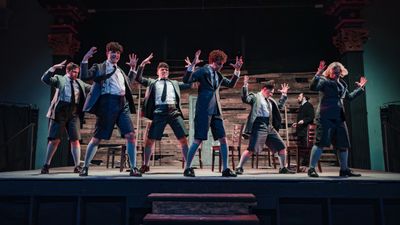 Warm amber-lit stage moment from Spring Awakening